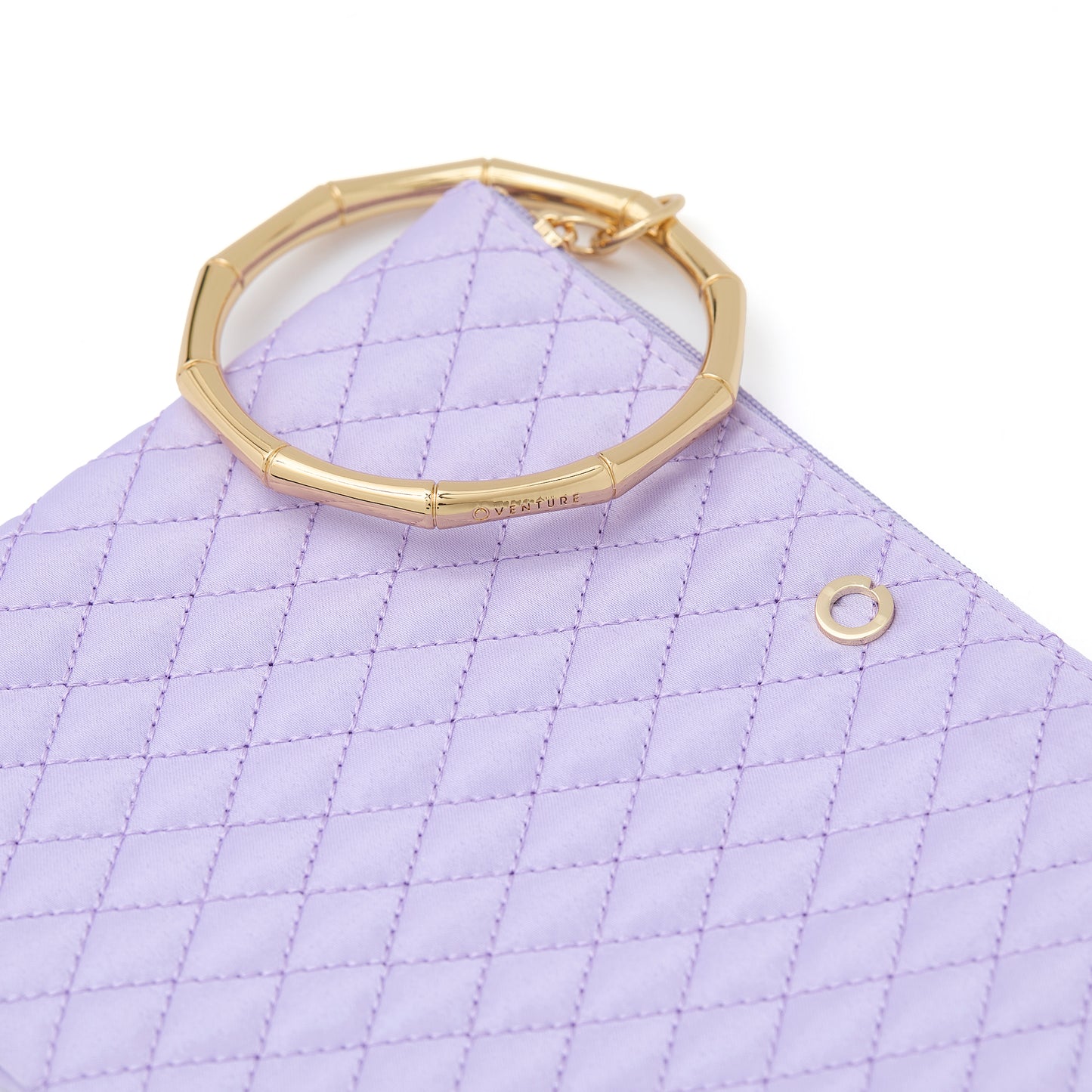 Quilted lavender bracelet bag for hands-free style.