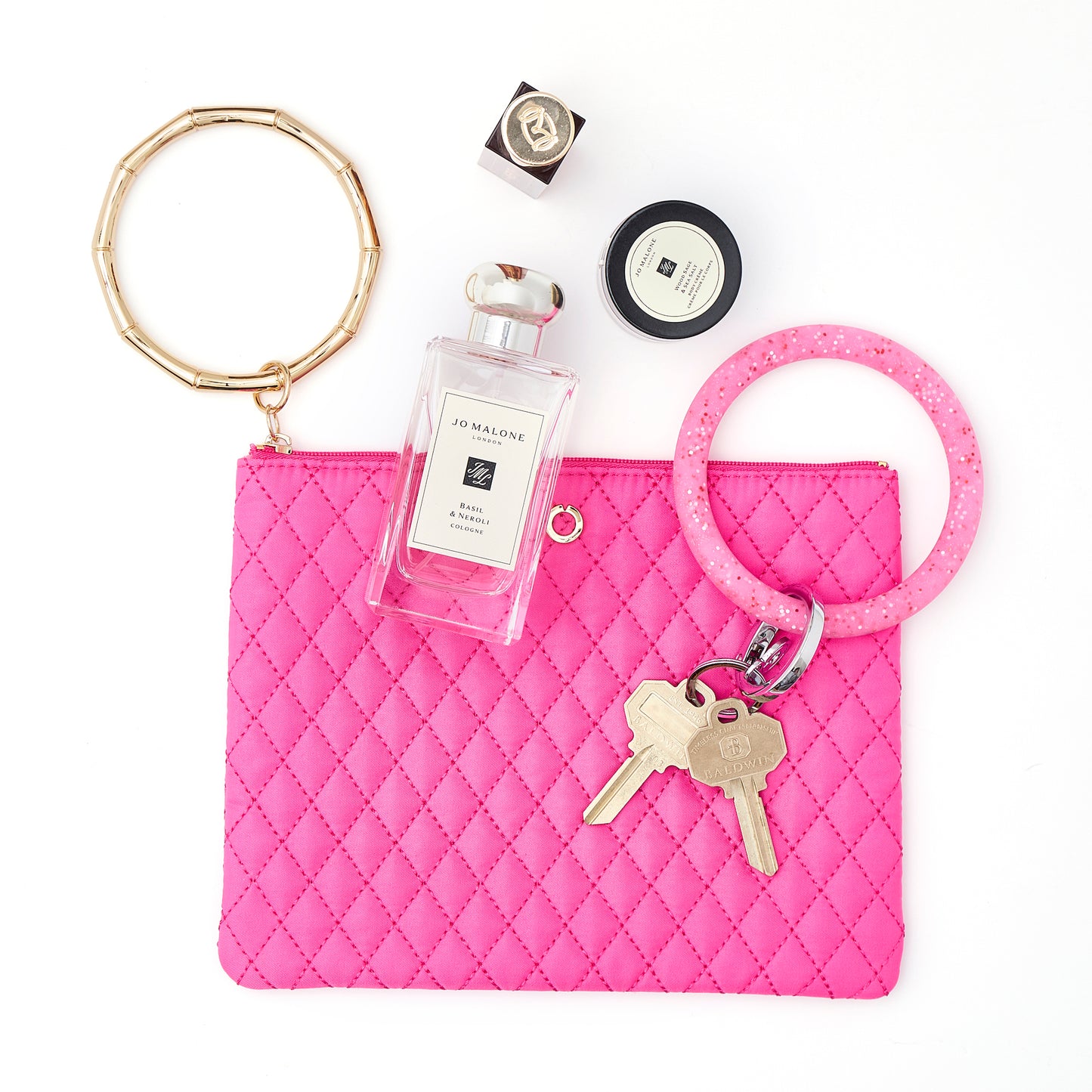 A chic Tickled Pink bracelet bag clutch