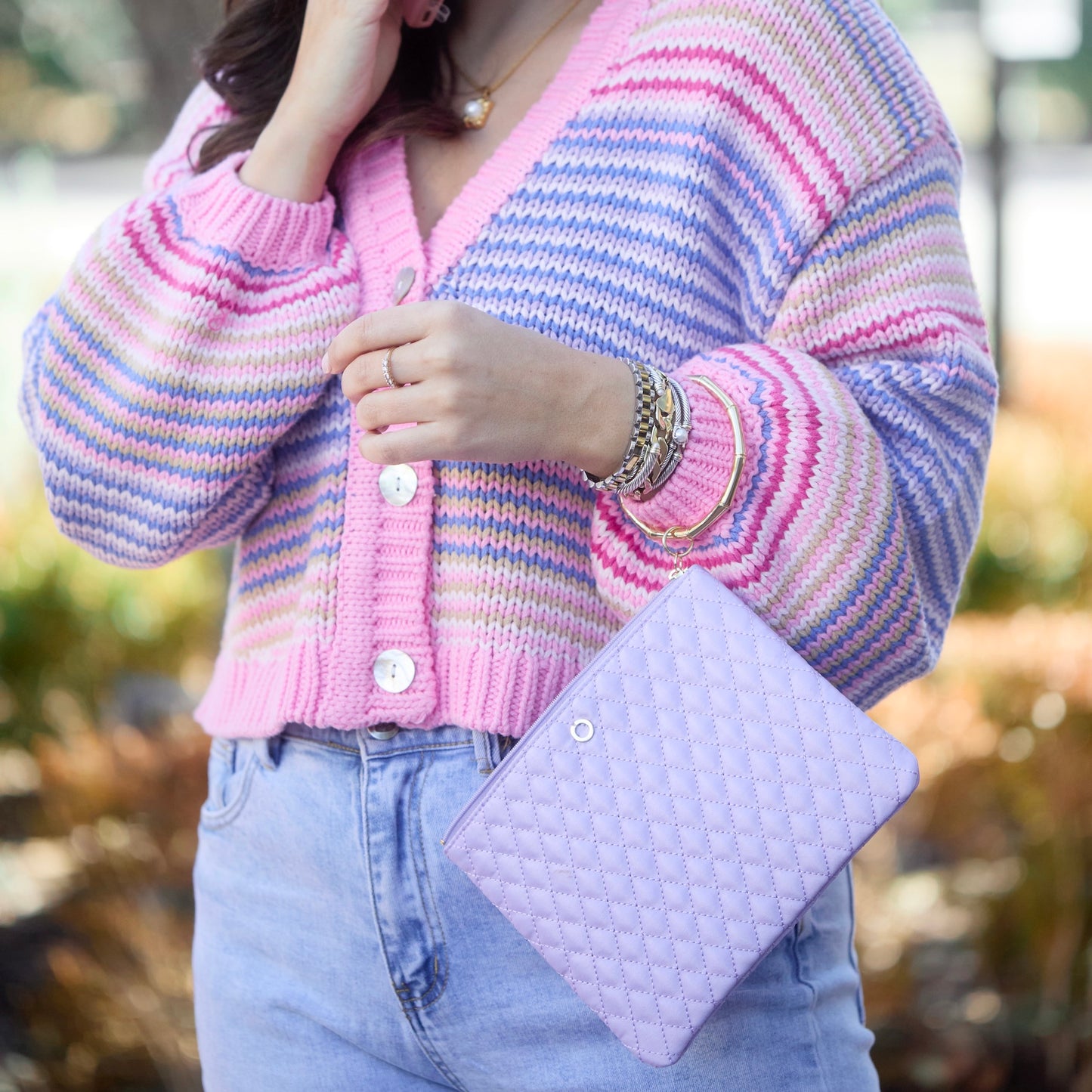 Quilted lavender bracelet bag for hands-free style.