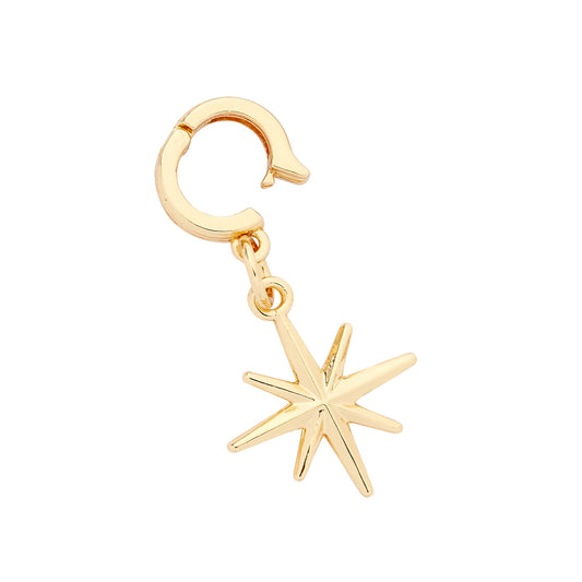 A gold-colored charm in the shape of a star with a polished finish, attached to a huggie-style closure.