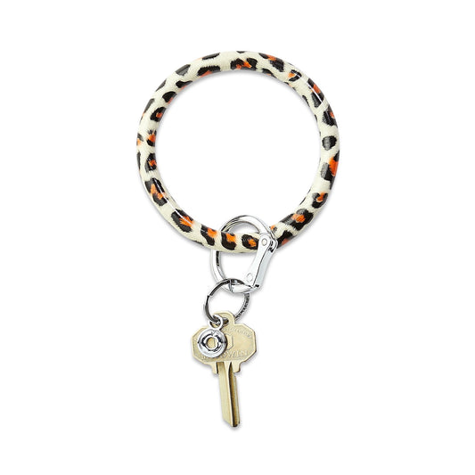Cheetah Print Leather Big O Key Ring with silver locking clasp.  This leather key ring is shown with key attached to the o ring locking clasp.