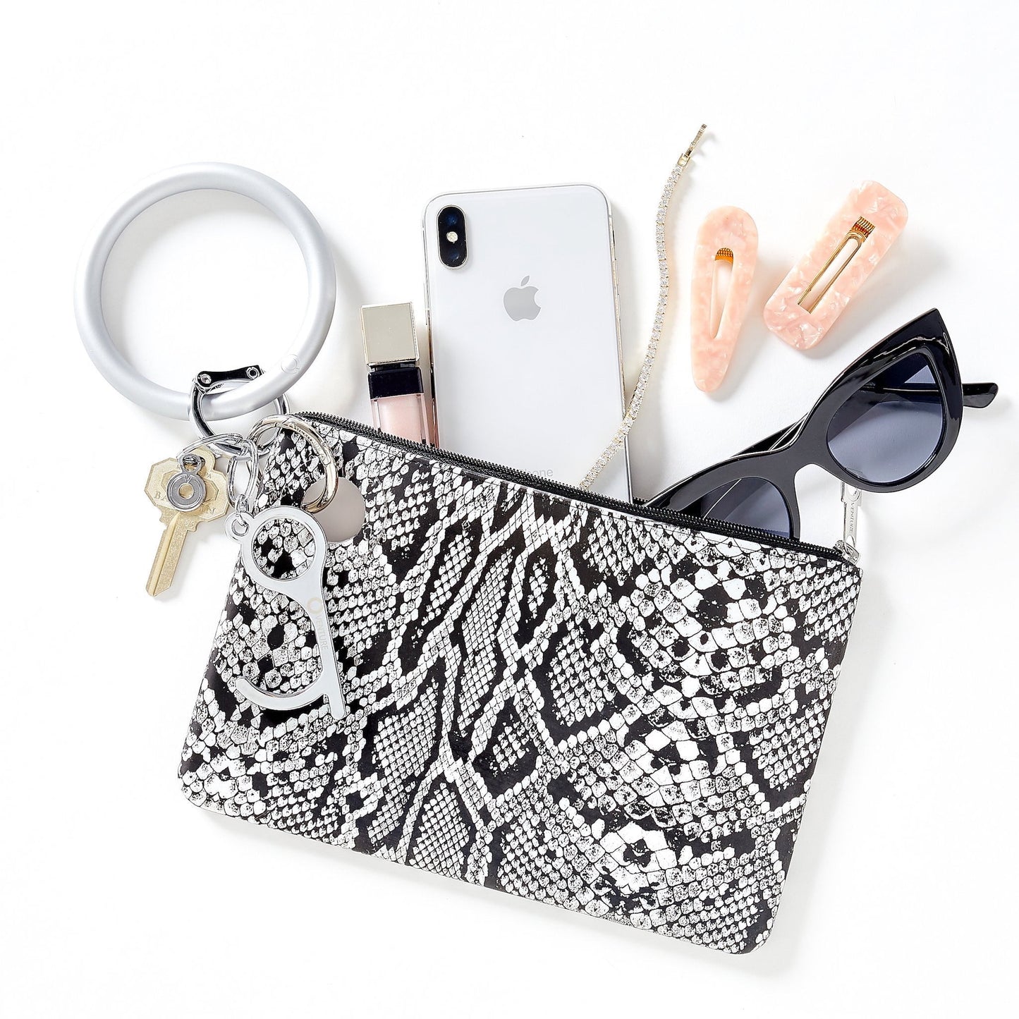 Solid Quicksilver Pearlized - Silicone Big O Key Ring by Oventure shown attached to the Large Silicone Pouch in tuxedo snakeskin print. Pouch contains sunglasses, iPhone, and lip gloss.