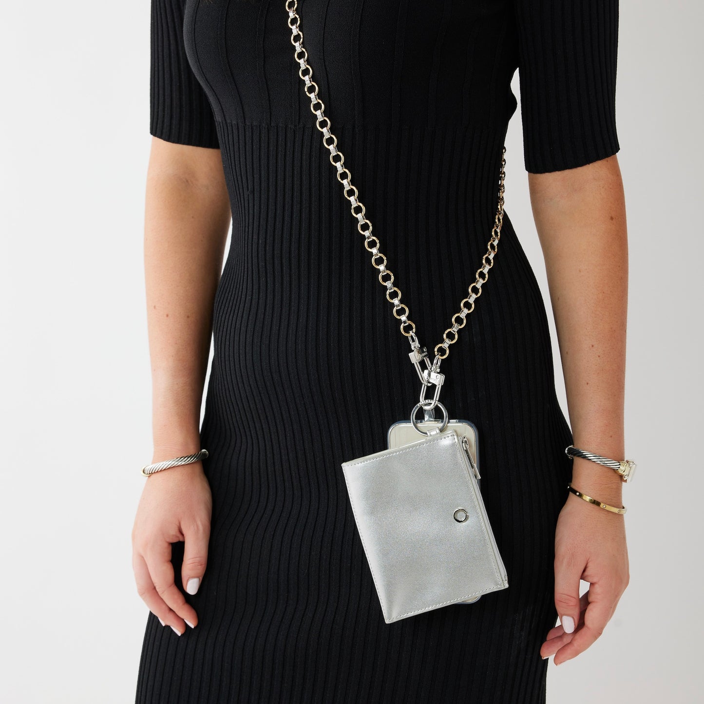 silver keyring wallet shown on crossbody phone strap.