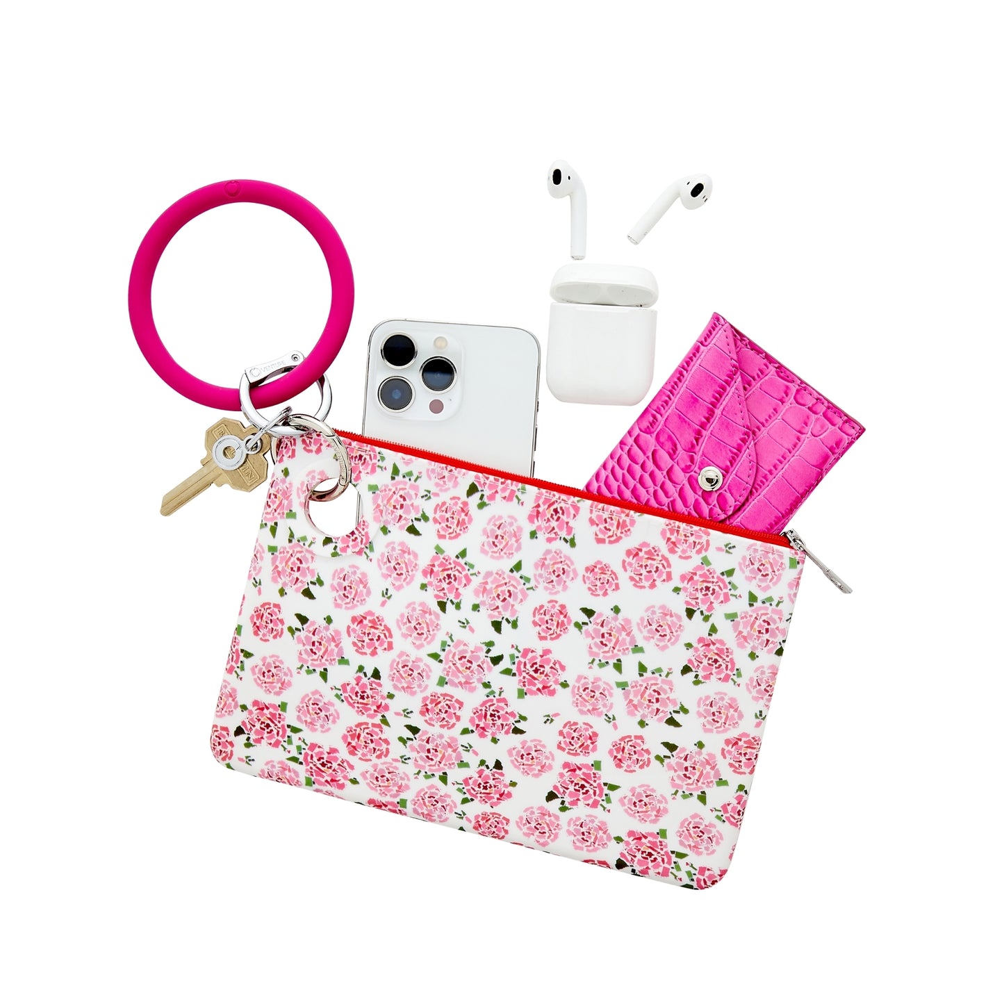 Large Pouch in pink peony print. Hooked to Bracelet Keyring in pink. Pouch contains iPhone, AirPods and wallet
