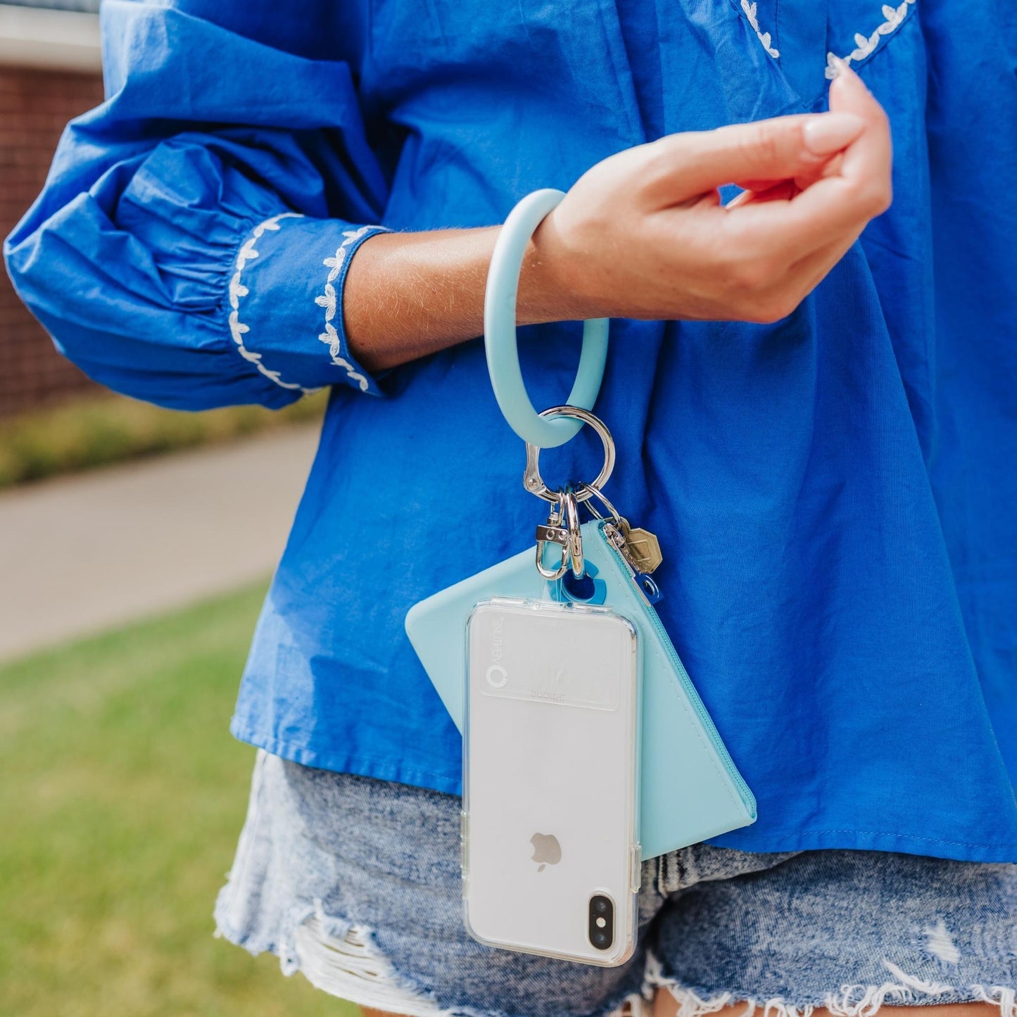 Silicone set that contains a sweet Carolina blue big o key ring with a mini silicone pouch in sweet Carolina blue and Hook Me up phone connector