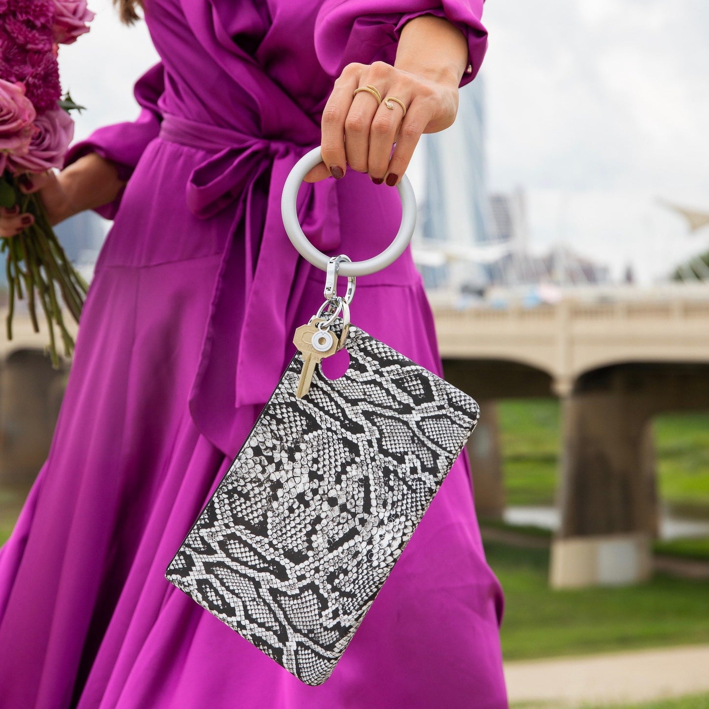 Large Pouch with black and white snakeskin print. Attached to Silver silicone Bracelet Keyring