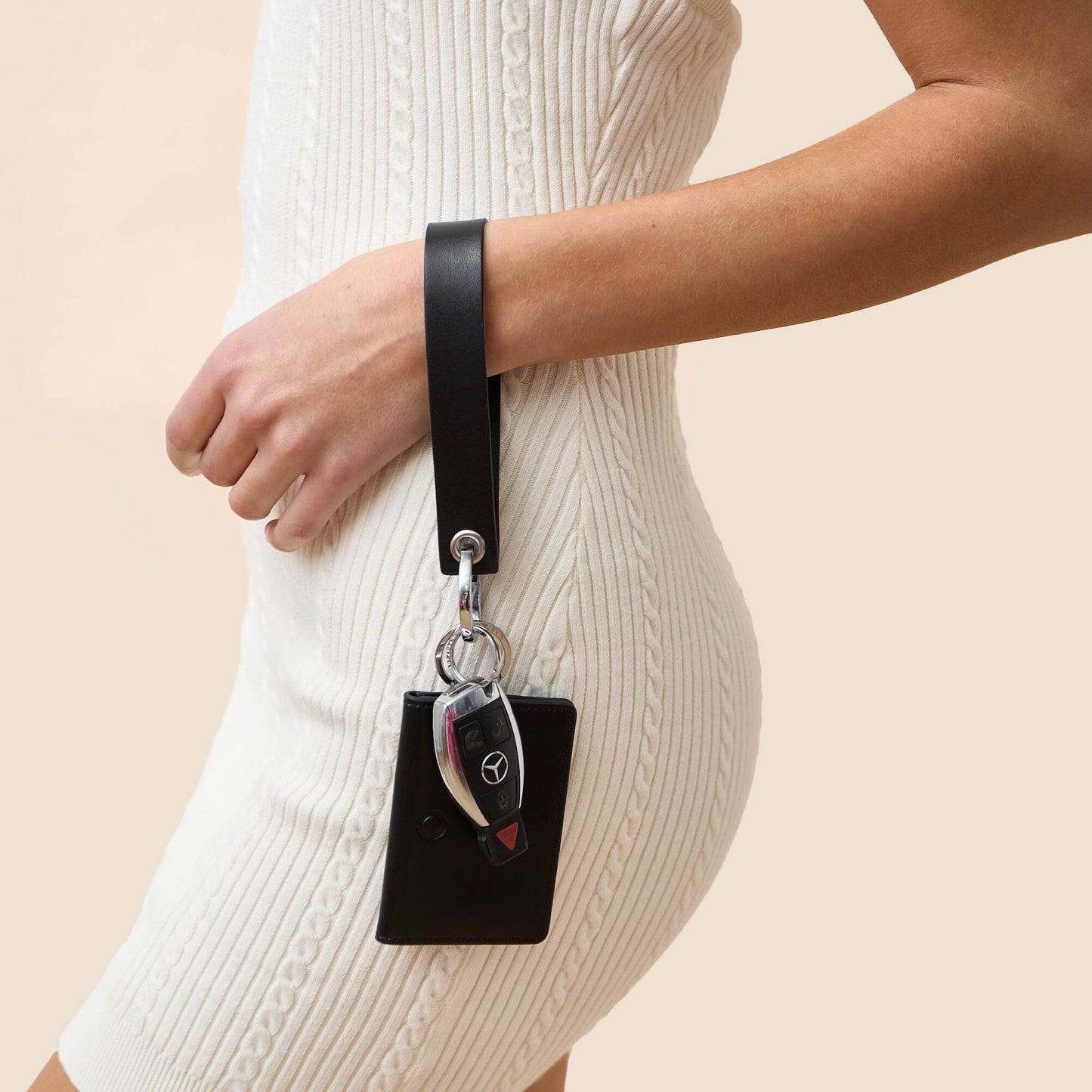 Stylish black leather wristlet keychain accessory loop.