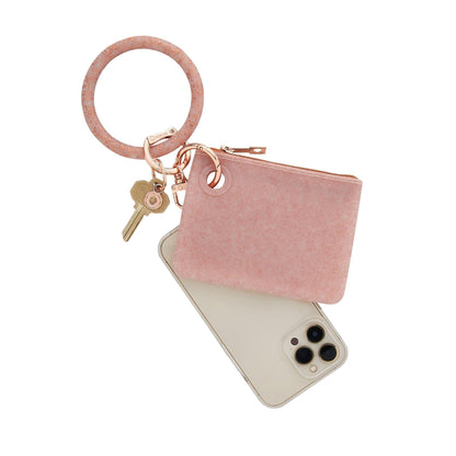Rose Gold 3 in 1 set includes Silicone Big O Key Ring in Rose Gold Confetti, Mini Pouch in Rose Gold Confetti and Phone Connector in Rose gold. Shown with phone attached