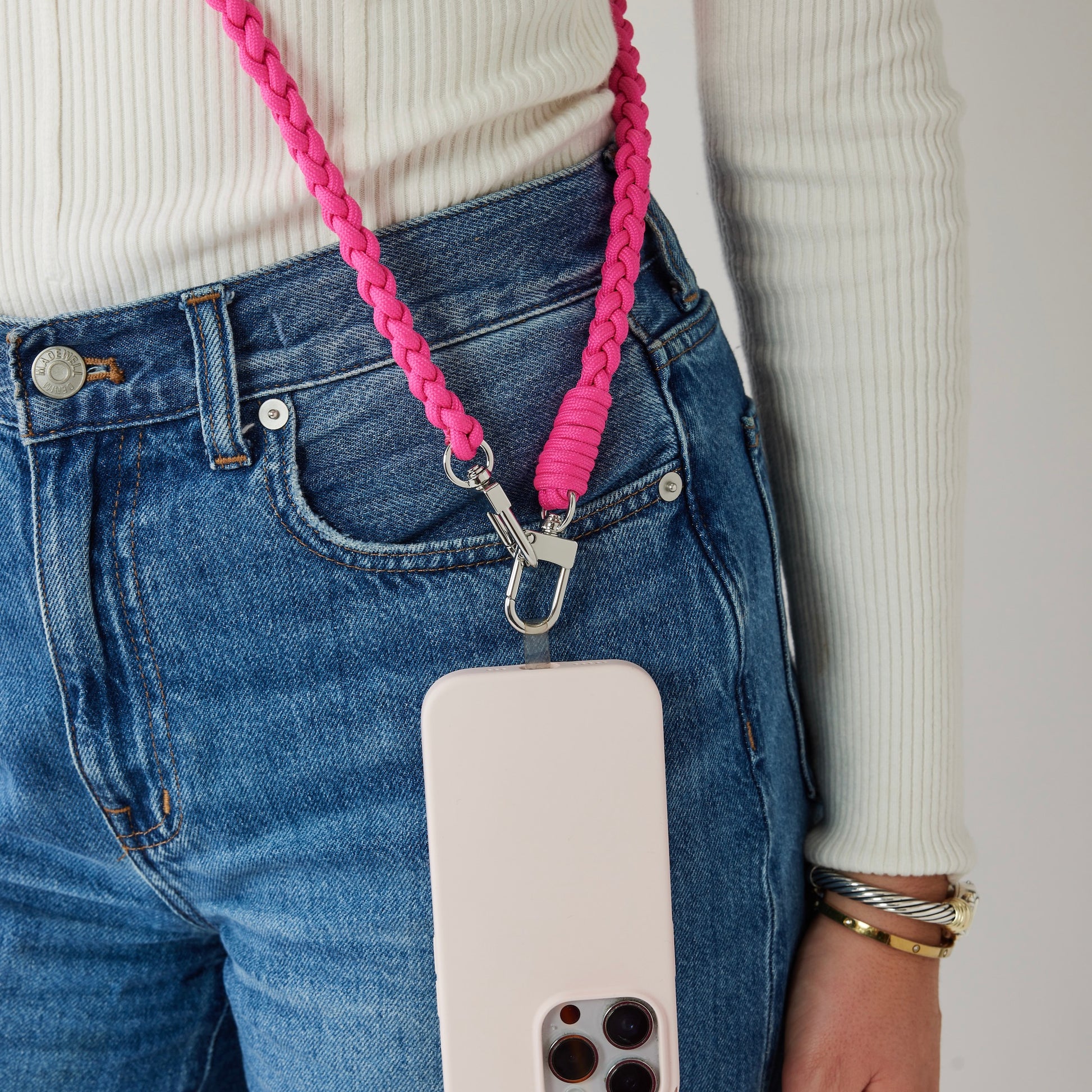 A braided crossbody strap for easy access.