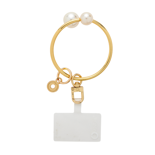 Big O Bracelet in gold with pearl ends by Oventure. Can attach phone or keys