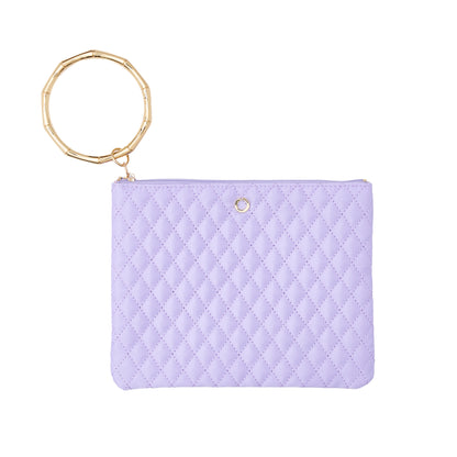 In The Cabana Quilted Bracelet Pouch  with gold bamboo bracelet attached.