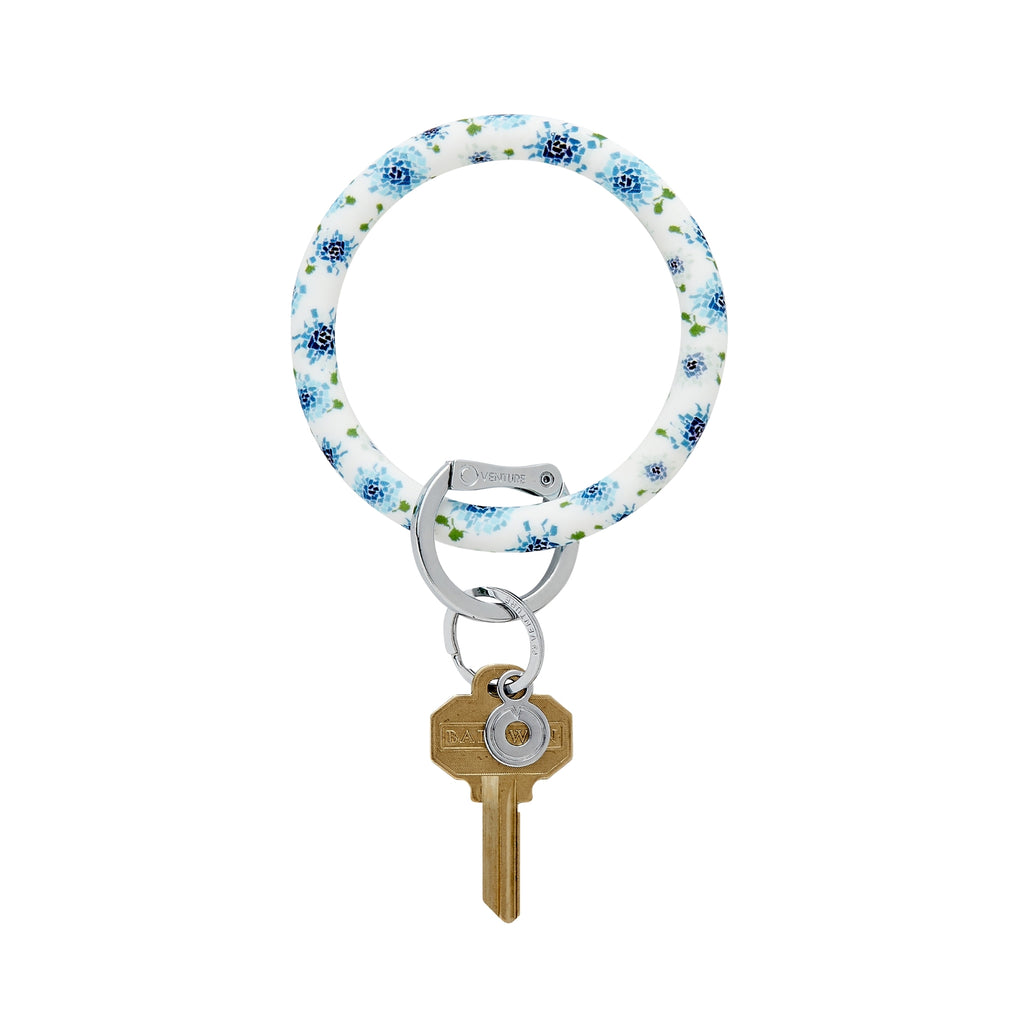 Silicone Big O Key Ring with a white background and blue hydrangeas made up of the shapes of the fifty states.  Key attached by Oventure signature locking clasp.