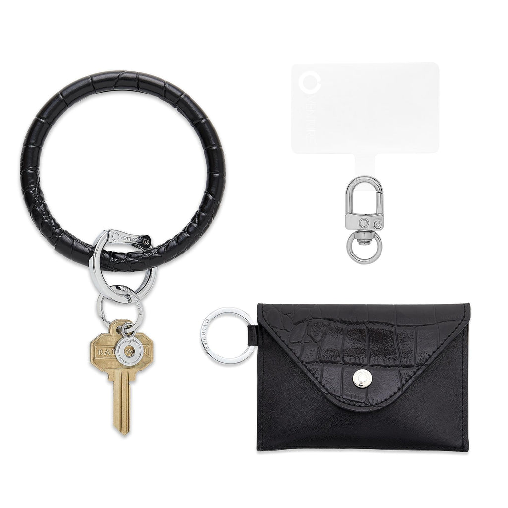 Three in One set with a black Big O Keyring in Black Croc embossed leather.  Mini envelope in black croc with a phone connector.