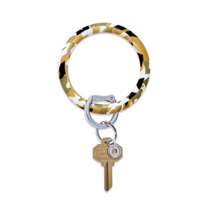 Camo - Silicone Big O Key Ring by Oventure. Shown with a gold key it shows the back side of the print