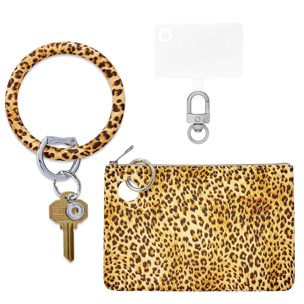 Three in one set with a big o keyring, large cheetah print silicone pouch and hook me up phone connector with silver hardware.
