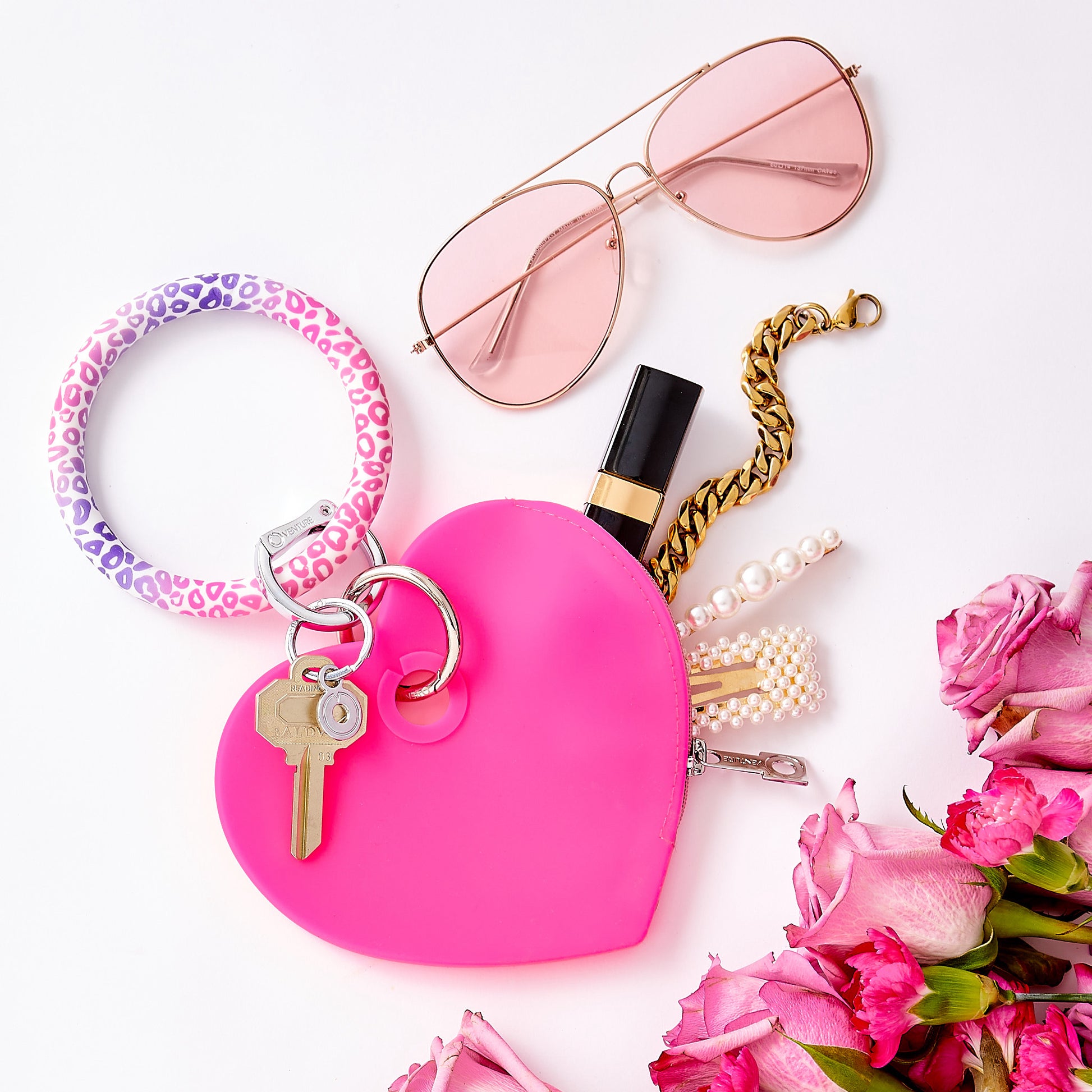 Tickled Pink - Silicone Heart Pouch - Oventure shown with Big O Key ring in pink cheetah silicone print