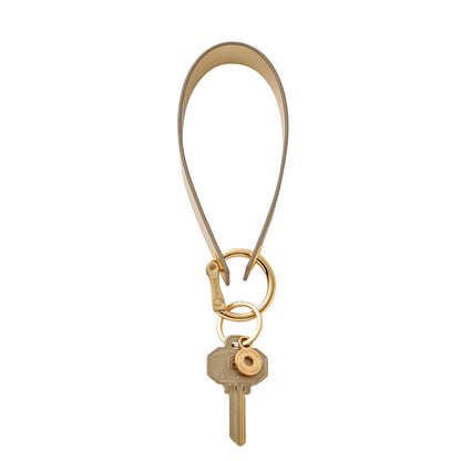 Stylish gold leather wristlet keychain accessory loop.