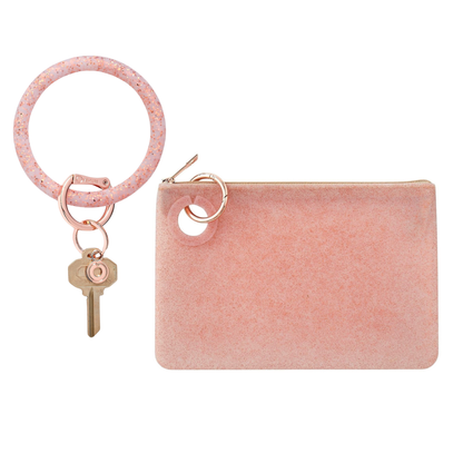 A sleek large pouch wristlet for organization in rose gold confetti.