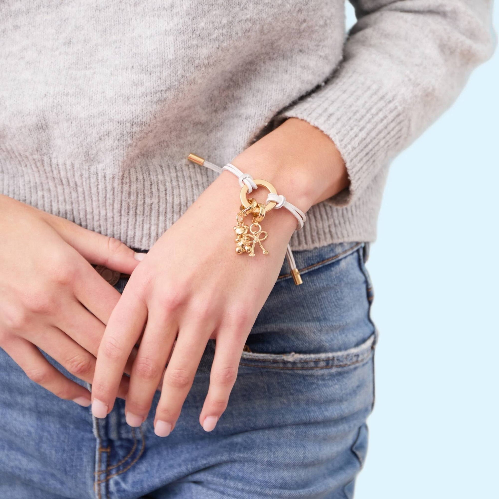 Leather cord bracelet with gold charms 