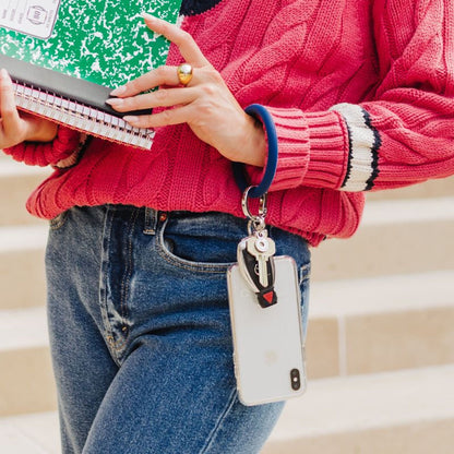 Stylish phone wristlet for hands-free convenience shown in navy silicone.