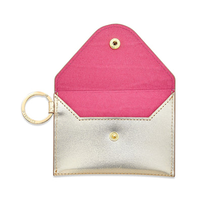Stylish leather keychain wallet in mini envelope design in gold leather.   Shown open with pink interior.