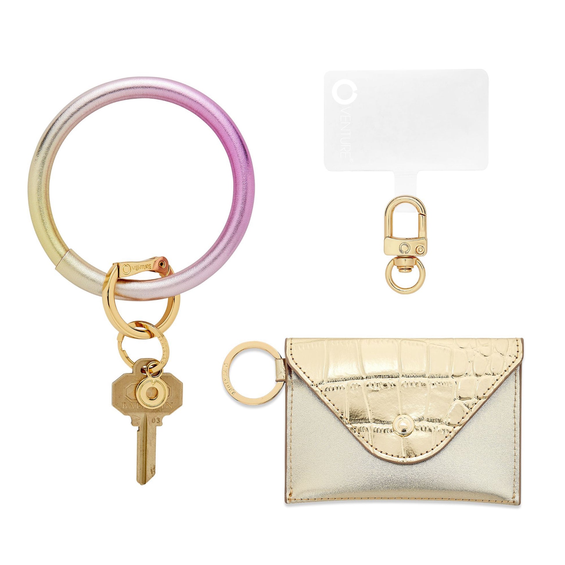 Three in one set which includes Big O Keyring in pink to gold ombre leather with gold mini envelope and phone connector