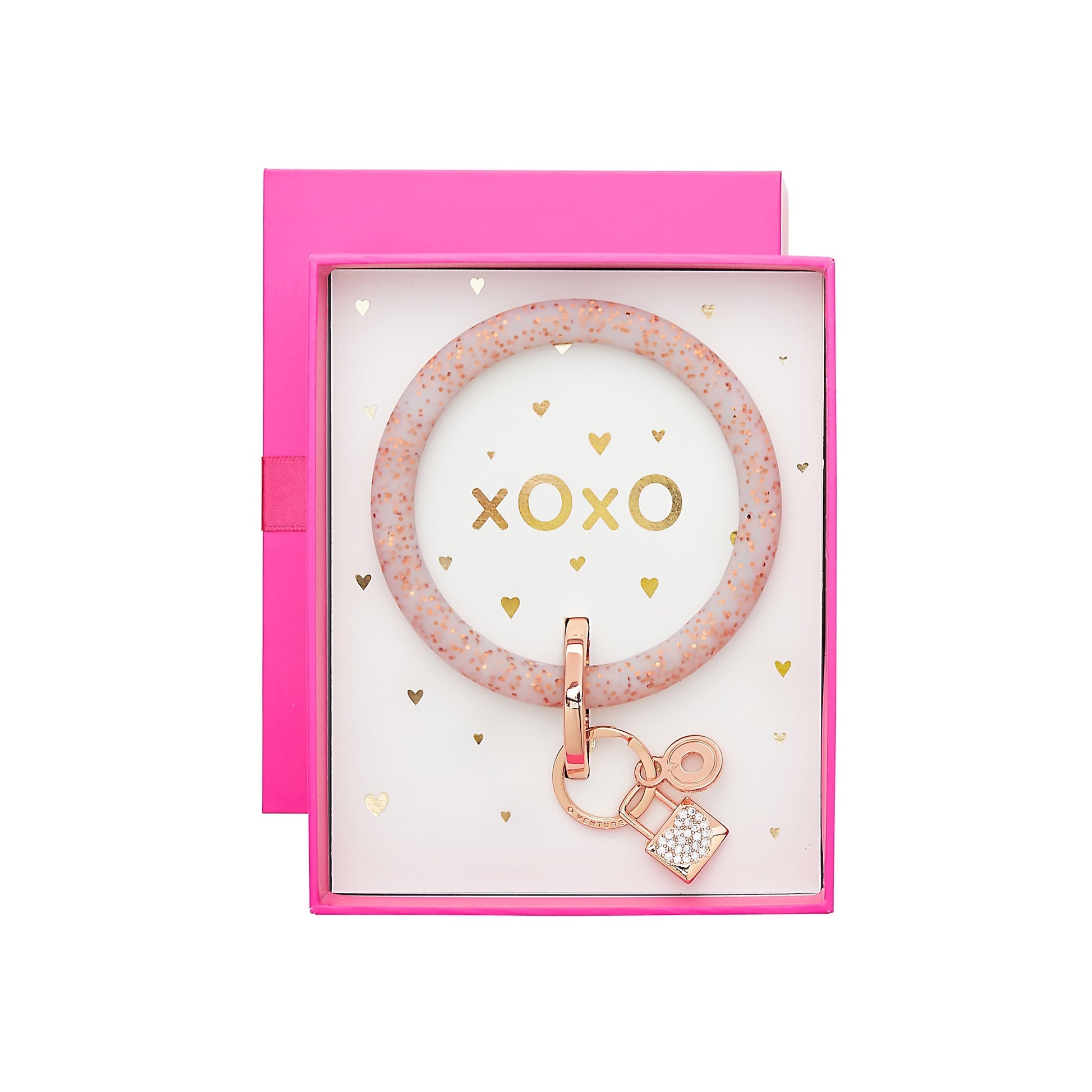 Silicone Rose Gold Confetti Big O Key Ring with Rose Gold Lock Charm placed inside a hot pink Oventure box that says xOxO in gold