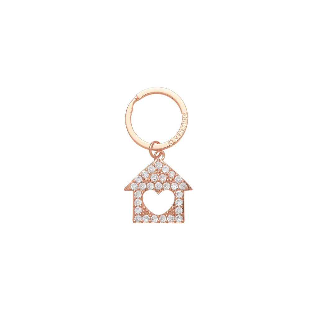 Rose gold home is where the heart is key ring. Bejeweled home with a heart cutout center. Can stand alone or be attached to a Big O Key Ring as a charm.