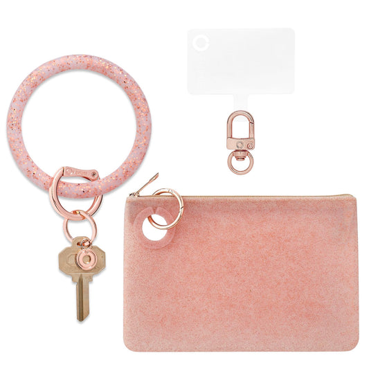 Oventure three in one set which includes a large silicone pouch and key ring in rose gold confetti.  Also includes a Hook Me up Phone connector with rose gold hardware.