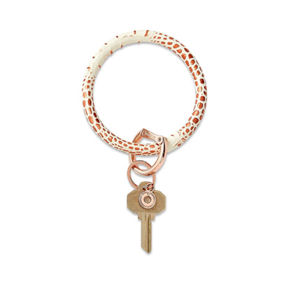 Rose Gold Croc-Embossed - Leather Big O Key Ring - Oventure. It has a white background with rose gold spots