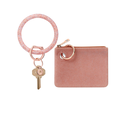 Mini pouch wristlet in smooth silicone material in rose gold confetti.