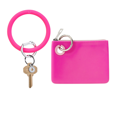 Mini pouch wristlet in smooth silicone material in pink.