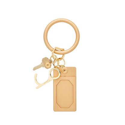 Solid Gold Rush - Silicone ID Case - Oventure. This is attached to a big O key ring in gold.