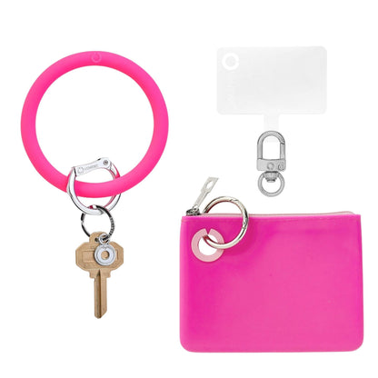 3-in-1 Tickled Pink Silicone Set - Mini This includes a big o key ring in hot pink, a phone connector, and a mini silicone pouch