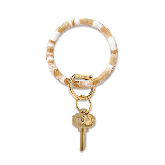 Gold Rush Marble - Silicone Big O Key Ring - Oventure. This is a swirl of gold and white with metallic flecks. Key fob attached.