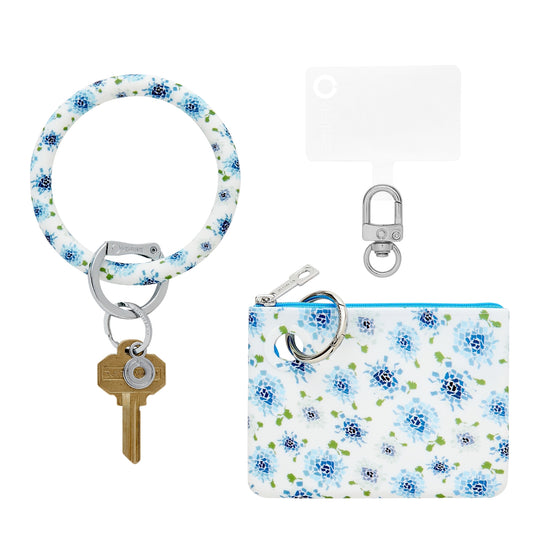 A chic and functional pouch wristlet accessory shown in blue hydrangea print.