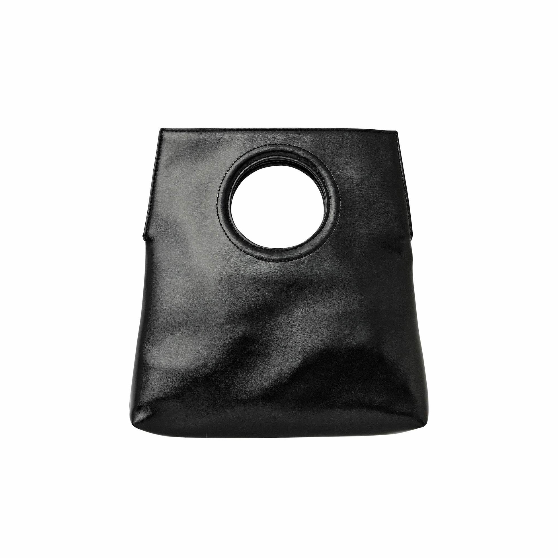Black handbag with circle handle on white background