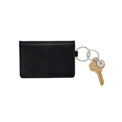 Sleek black leather bifold Keychain Wallet with compartments shown with key attached.