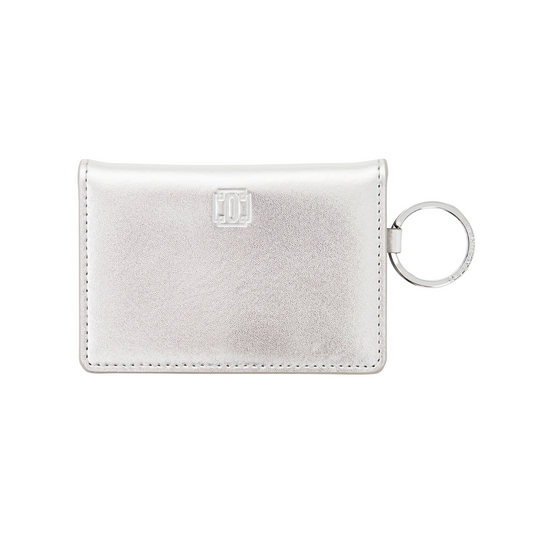 Sleek silver leather keychain wallet with compartments with key attached in silver leather.  Front side.