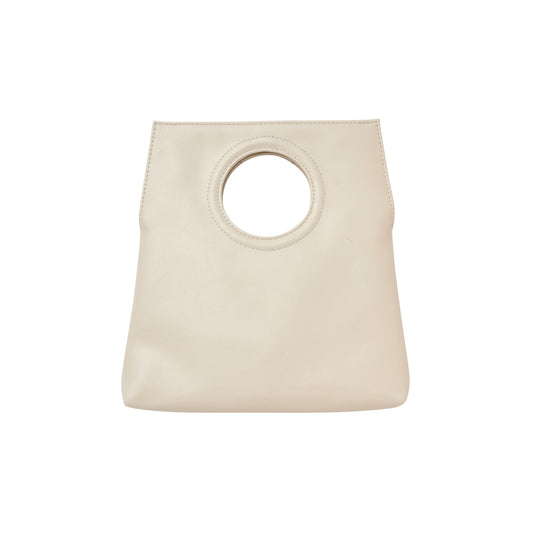 Beige handbag with circular handle on a white background