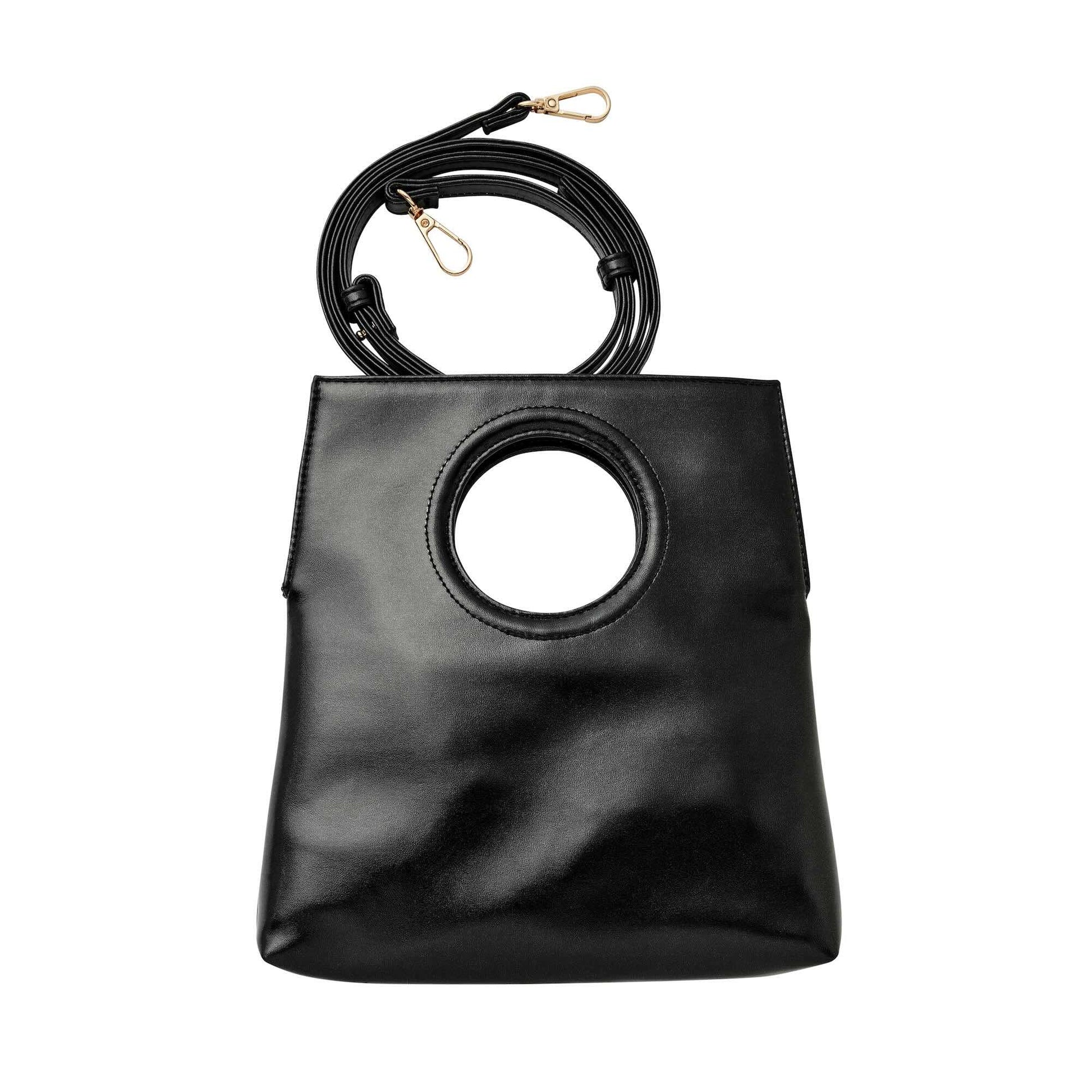 Black handbag with circular design on a white background