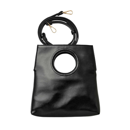 Black handbag with circular design on a white background