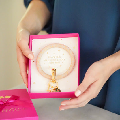 Oventure gift wrapped gold confetti big o keyring in hot pink gift box with silk bow.