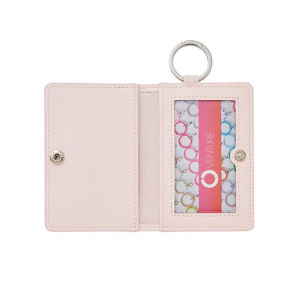 Keychain wallet in light pink. Open to show ID case window 