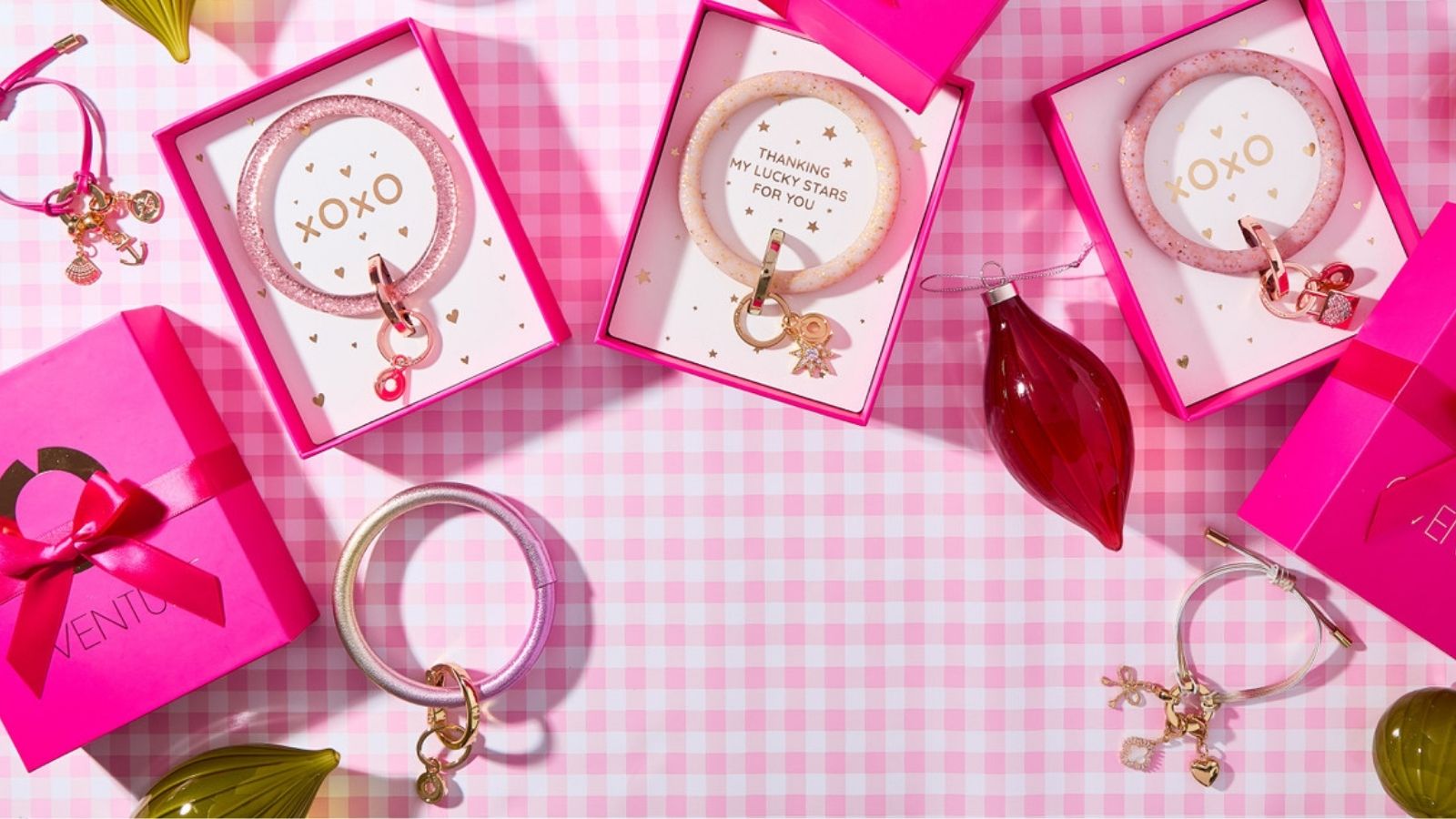 Gift-boxed Big O® Key Rings on pink holiday gingham with ornaments