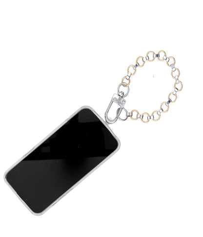 A stylish gold and silver phone charm accessory.
