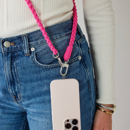 Pink nylon braided crossbody with phone connected up close