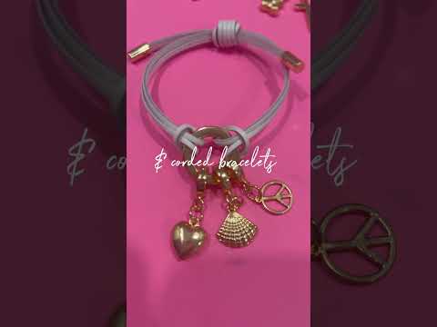 Leather cord bracelet with gold charms