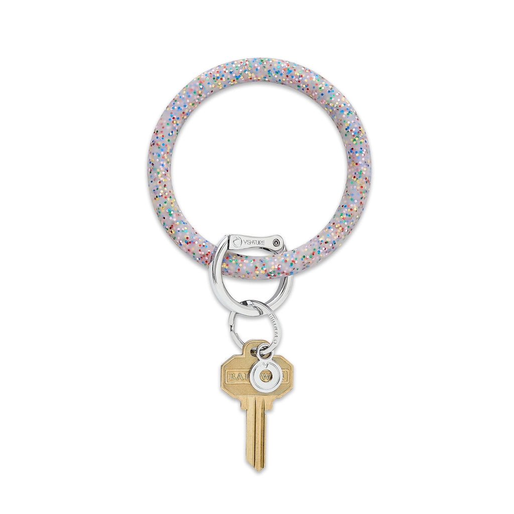 Rainbow Confetti Big O Key Ring. Gray background with rainbow glitter with silver locking clasp