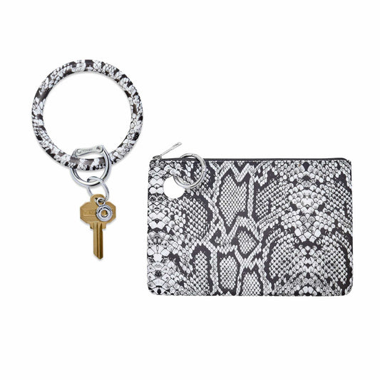Black and white snakeskin-print silicone Big O® Key Ring with gold house key, paired with a matching water-resistant silicone pouch wristlet, shown on a white background.
